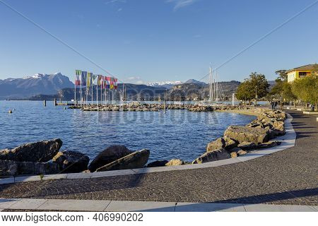 Cisano, Italy - 01 26 2021: The Port Of Cisano Near Sunset On A Winter Afternoon.