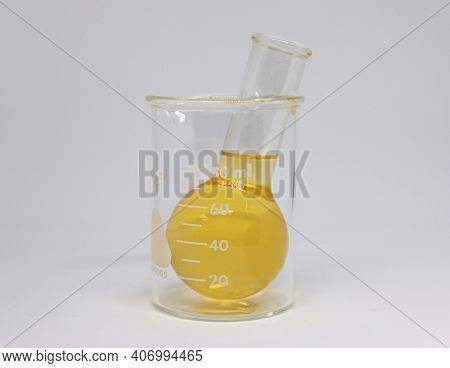Yellow Chemical Is A Glass Beaker Placed In Another Larger Beaker For Scientific Experimental Use Wi