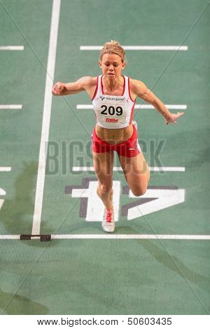 VIENNA, AUSTRIA - JANUARY 29 Hayley Jones (#209 Great Britain) places 2nd in the women's 60m event on January 29, 2013 in Vienna, Austria.