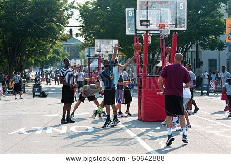 Man Drives And Shoots Layup In Street Basketball Tournament