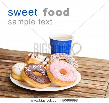 plate of donuts and blue coffee mug