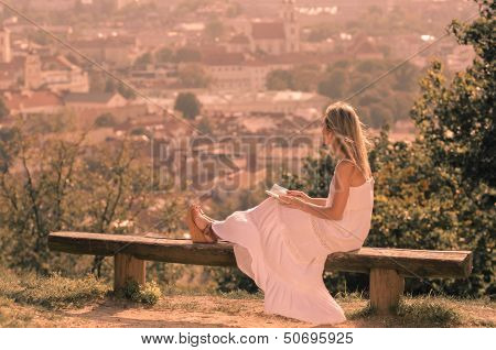 young woman reading book in Vilnius, Lithuania