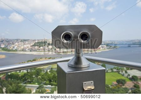 Binoculars On An Aerial Viewing Platform Over City