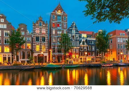 Night City View Of Amsterdam Canal With Dutch Houses