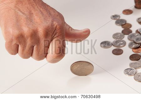 Man's hand tossing coin closeup
