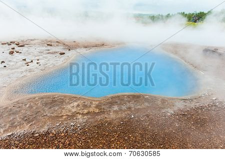 Blue pool Blesi at Haukadalur geothermal field, Iceland