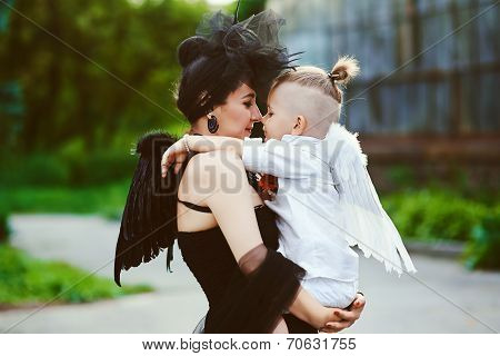 Mom with son playing good and evil