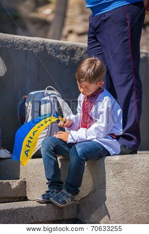 ODESSA, UKRAINE - August 23: Flash mob in city of Odessa on Potemkin Stairs on August 23, 2014, in day of a national flag of Ukraine. Happy participants of summer Flash mob with a flag