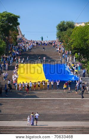 ODESSA, UKRAINE - August 23: Flash mob in city of Odessa on Potemkin Stairs on August 23, 2014, in day of a national flag of Ukraine.