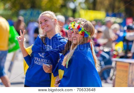 ODESSA, UKRAINE - August 23: Flash mob in city of Odessa on Potemkin Stairs on August 23, 2014, in day of a national flag of Ukraine. Happy participants of summer Flash mob with a flag