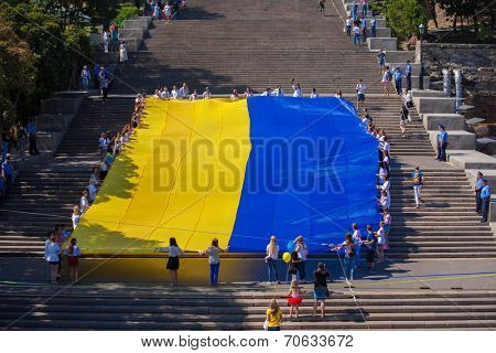 ODESSA, UKRAINE - August 23: Flash mob in city of Odessa on Potemkin Stairs on August 23, 2014, in day of a national flag of Ukraine.