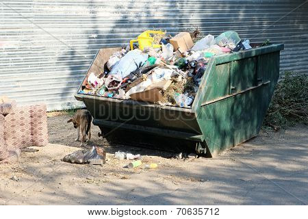 Overfilled trash dumpster in ghetto neigborhood in Russia
