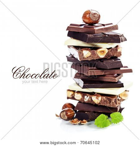 An assortment of  white, dark, and milk chocolate with nuts - on white bckground