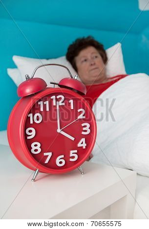 Senior Woman In Bed Ill And Suffered Of Sleeplessness Or Insomnia.