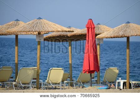 Parasol And Sunbed On The Beach