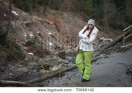 Young Woman On A Mountain River