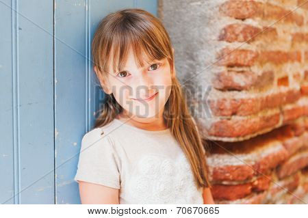 Outdoor portrait of a cute little girl