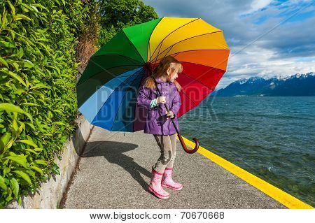 Little girl with colorful umbrella