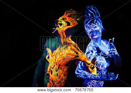 Body art glowing in ultraviolet light,  four elements, Air against Fire