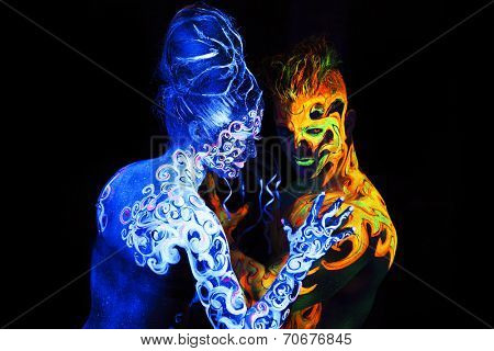 Body art glowing in ultraviolet light,  four elements, Air against Fire