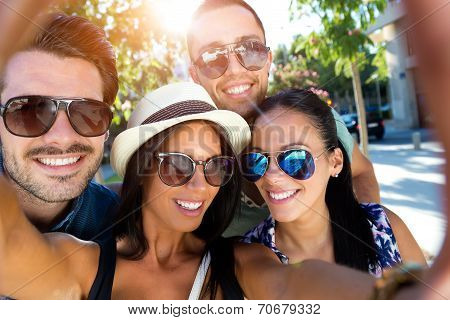 Portrait Of Group Friends Taking Photos With A Smartphone.