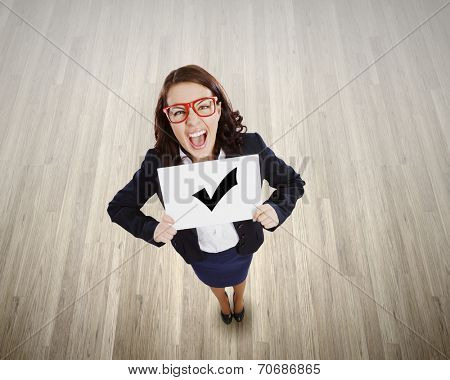 Top view of businesswoman holding white banner with red tick