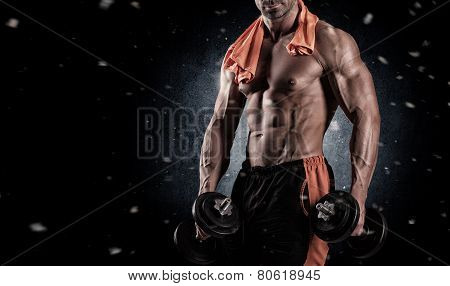 Muscular Bodybuilder Guy Doing Exercises With Dumbbells Over Black Background