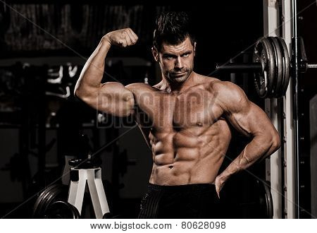 man straining biceps