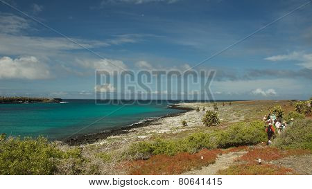Galapagos Islands, Ecuador - July 2014: Travelers Hiking in South Plaza Island
