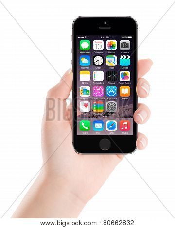 Apple Space Gray Iphone 5S Displaying Ios 8 In Female Hand, Designed By Apple Inc