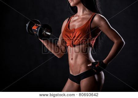Brutal Athletic Woman Pumping Up Muscles With Dumbbells