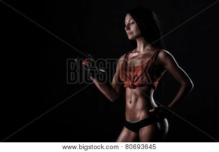 Brutal Athletic Woman Pumping Up Muscles With Dumbbells