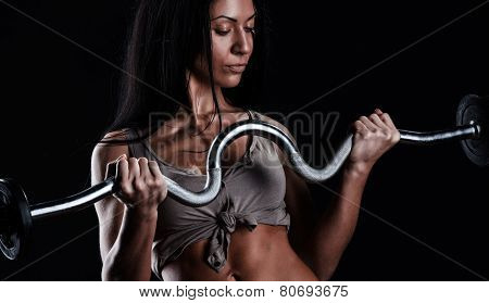 Brutal Athletic Woman Pumping Up Muscles With Dumbbells