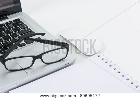 Blank Business Laptop, Mouse, Pen, Glasses And Note