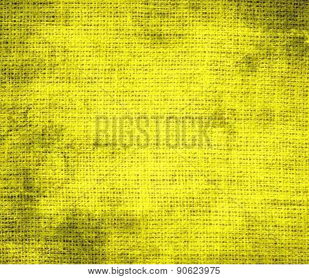Grunge background of aureolin burlap texture