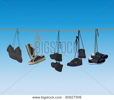 The Footwear Hanging On A Rope.
