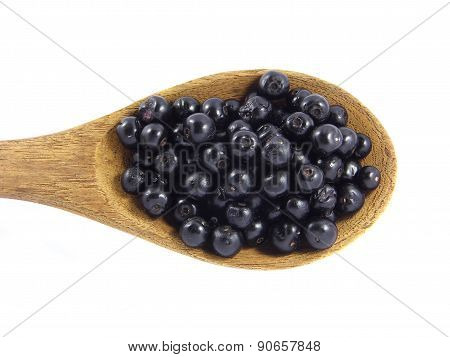 Jambolan plum or Java plum on wooden spoon