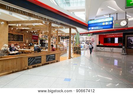 DUBAI, UAE - MARCH 10, 2015: DXB airport interior. Dubai International Airport is the primary airport serving Dubai, and is the world's busiest airport by international passenger traffic.