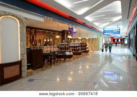 DUBAI, UAE - MARCH 10, 2015: DXB airport interior. Dubai International Airport is the primary airport serving Dubai, and is the world's busiest airport by international passenger traffic.
