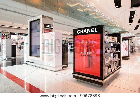 DUBAI - MARCH 10, 2015: Dubai duty-free shopping area interior. Dubai International Airport is the primary airport serving Dubai and is the world's busiest airport by international passenger traffic