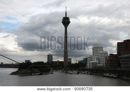 DUSSELDORF, GERMANY - AUGUST 6, 2012: Rheinturm or the Rhine Tower in the Medienhafen District in Dusseldorf, North Rhine-Westphalia, Germany.
