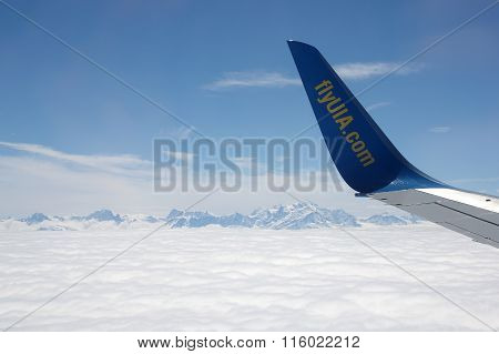 An Aircraft Wing Over Clouds