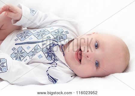 Baby In Embroidered Shirt