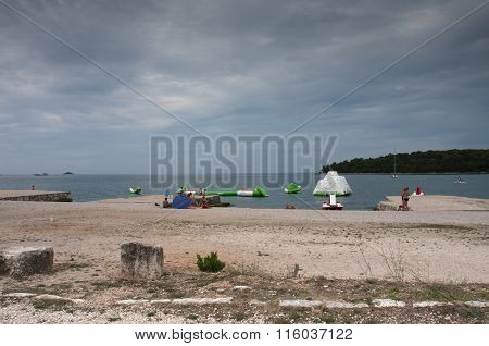 Town Beach In The Summer Day In Rovinj In Croatia