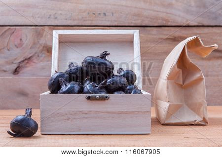 Chinese Water Chestnut ,water Nut Or Matai Roots In Wooden Box And Paper Bag On Rustic Old Wooden Ba
