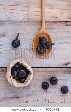 Chinese Water Chestnut ,water Nut Or Matai Roots In Wooden Spoon And Paper Bag On Rustic Old Wooden