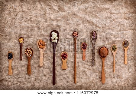 Mixed Beans And Lentils In The White Bowl  On Brown Background. Mung Bean, Groundnut, Soybean, Red K