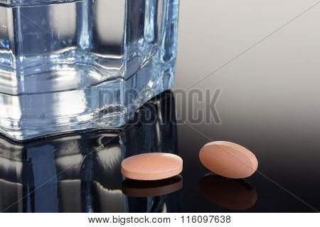 Statin Tablets With Glass Of Water