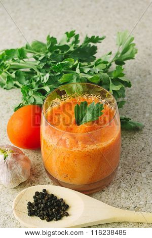 Carrot And Tomato Gaspacho In Glass On The Table