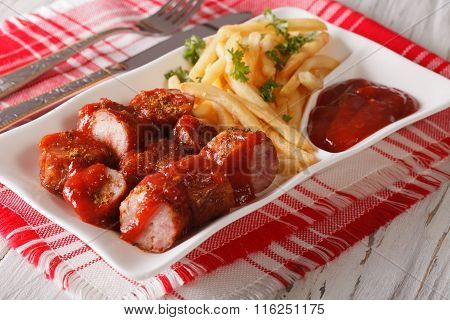Currywurst Sausage With French Fries Close-up. Horizontal
